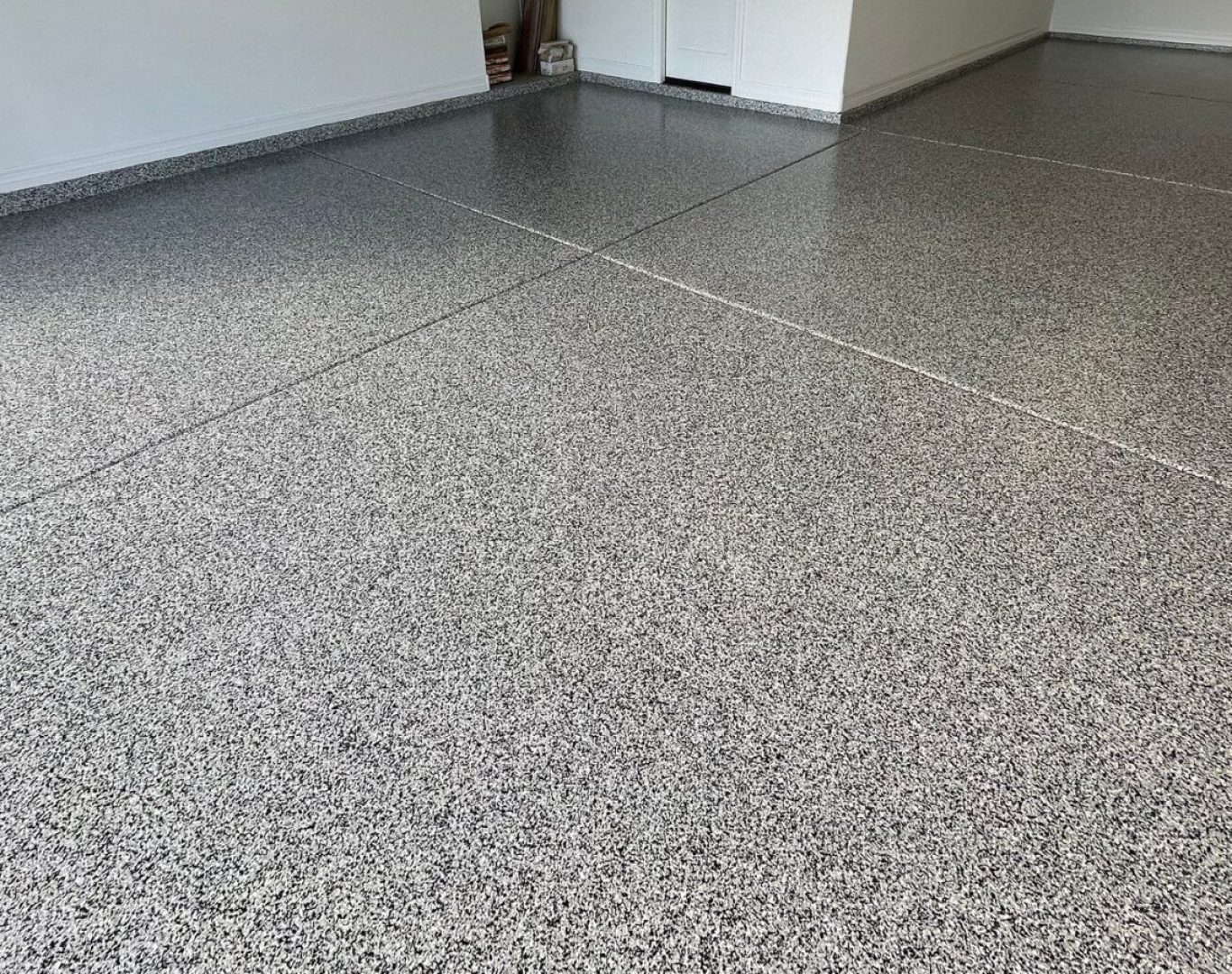 Colorful Concrete Solutions team applies concrete coatings in Milwaukee County, WI, highlighting skill and pro tools.